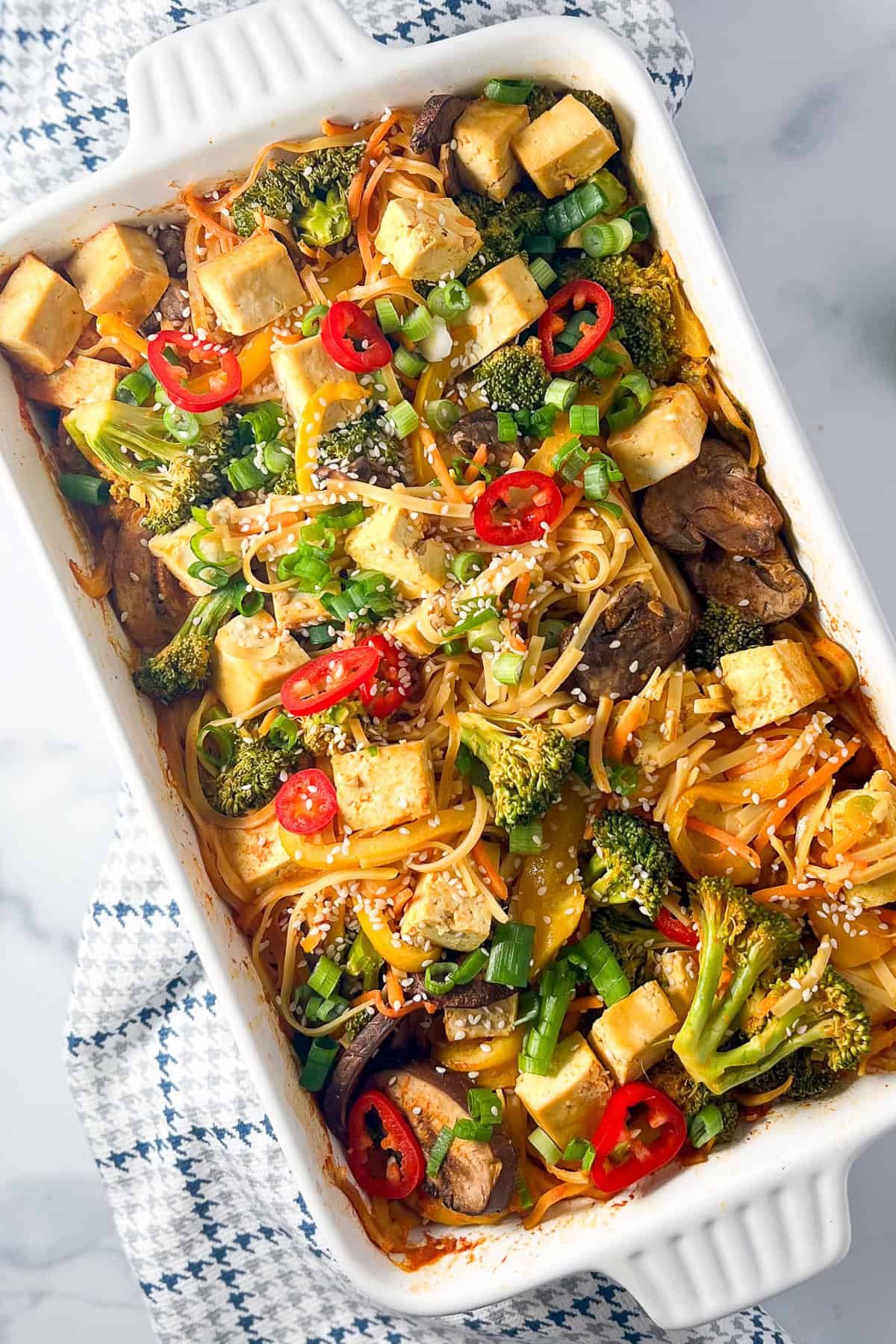 Baked Asian Noodles with tofu and veggies in a casserole dish.