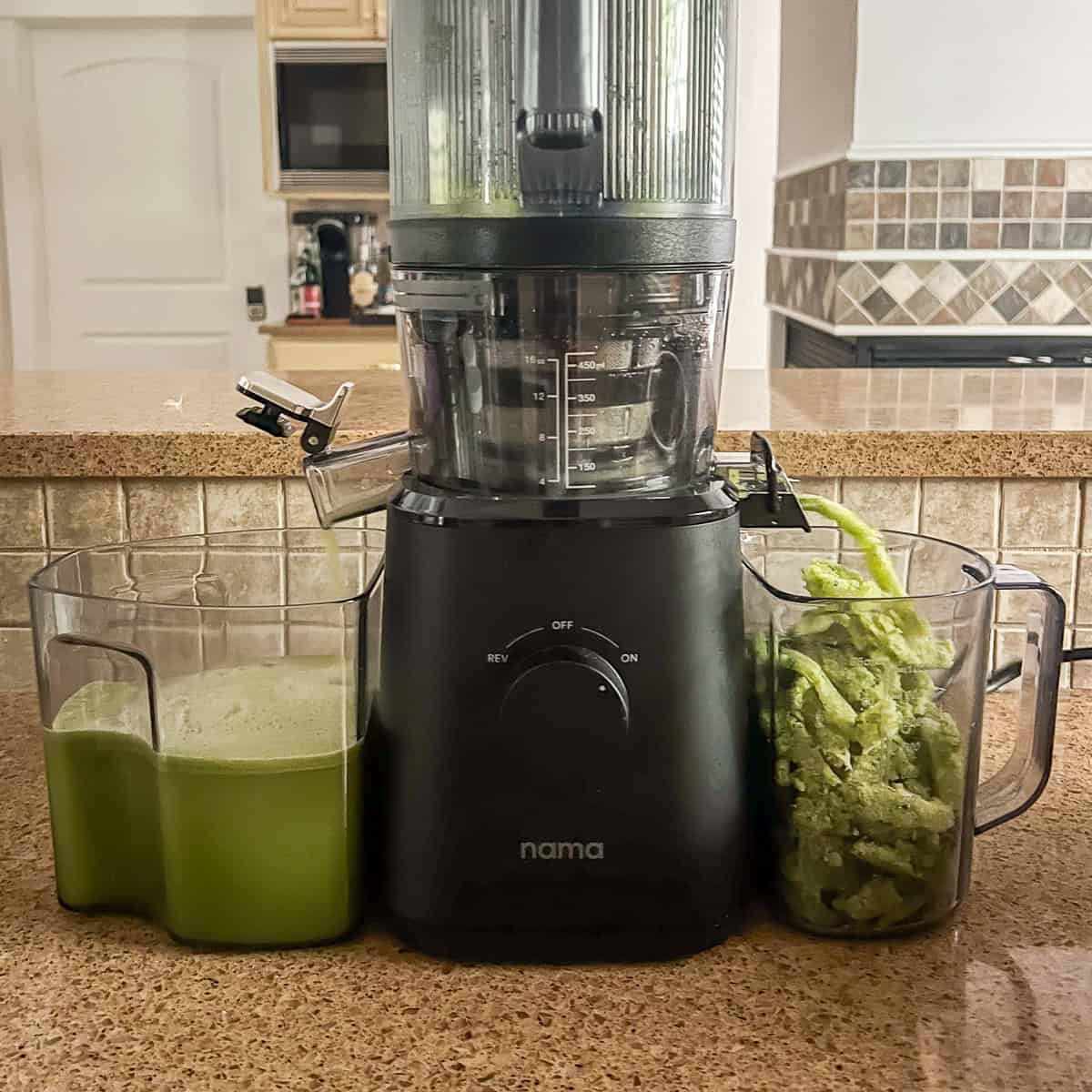 Celery cucumber juice being juiced in a juicer.