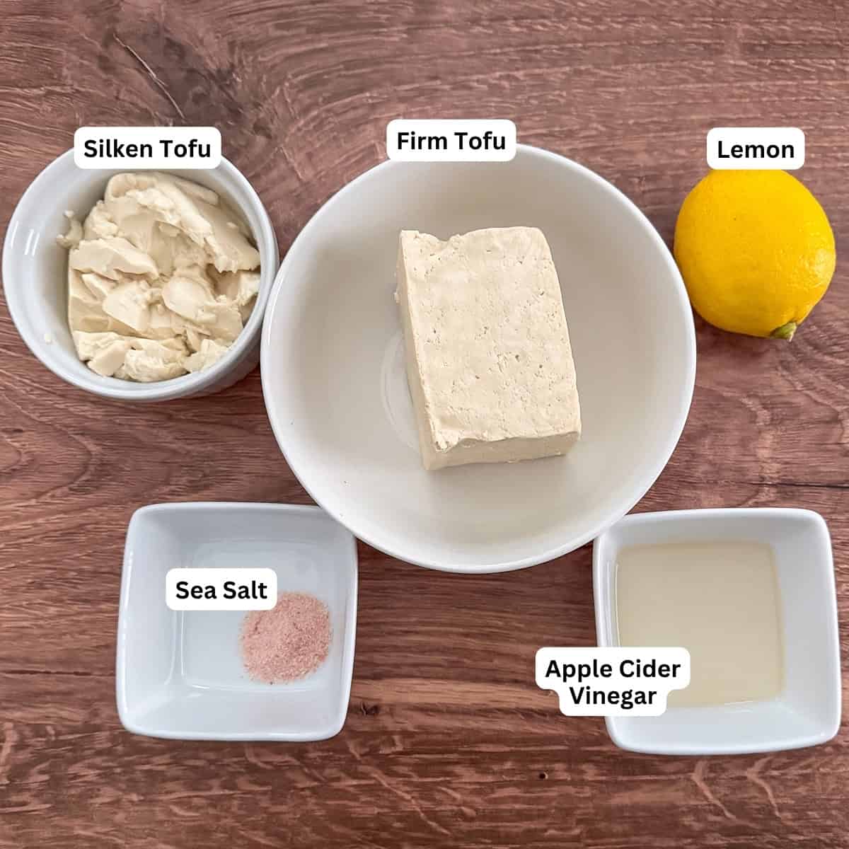 Ingredients for vegan cottage cheese: firm tofu, silken tofu, fresh lemon juice, apple cider vinegar, and sea salt.