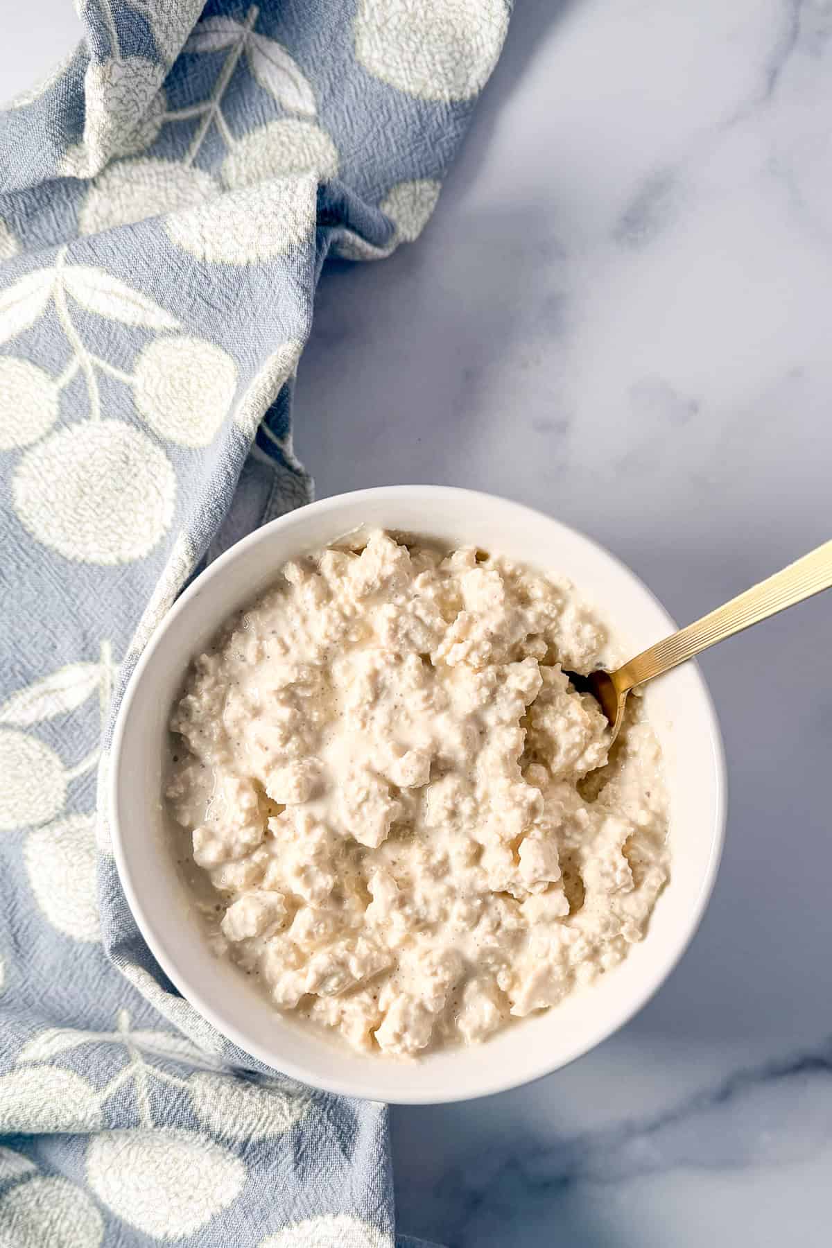 Vegan cottage cheese in a bowl with a spoon.
