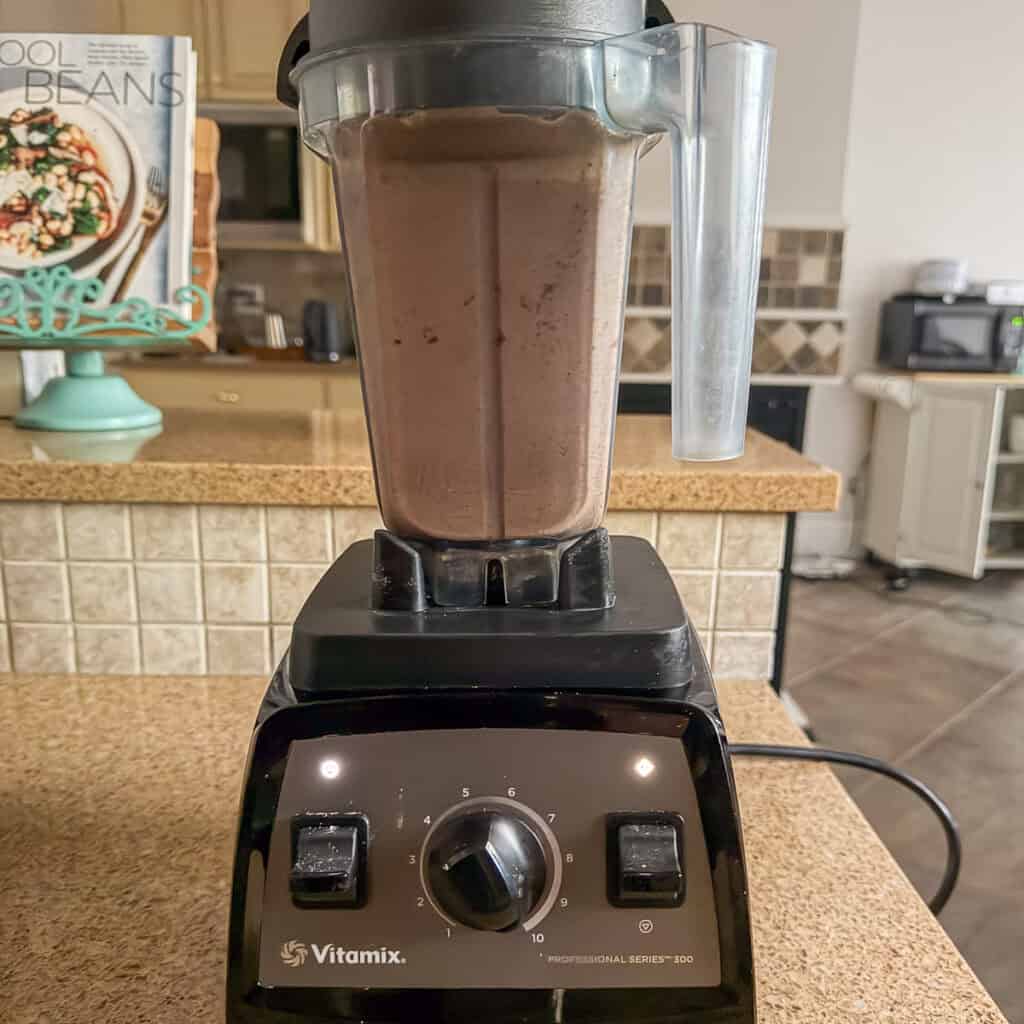 Smoothie being blended in a blender.