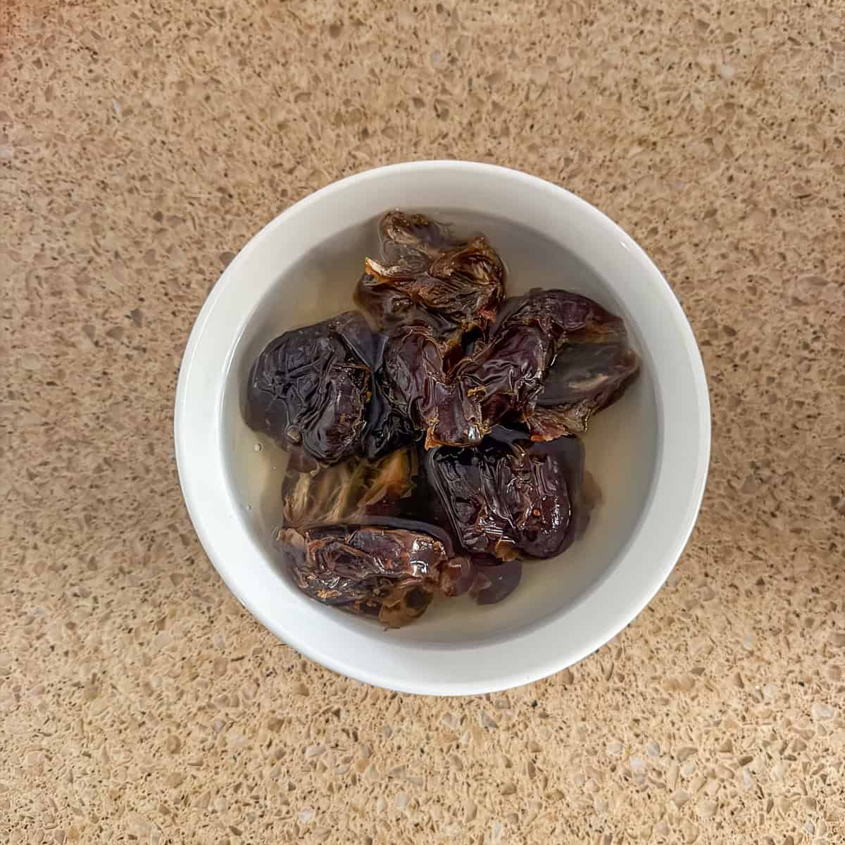 Dates soaking in hot water.