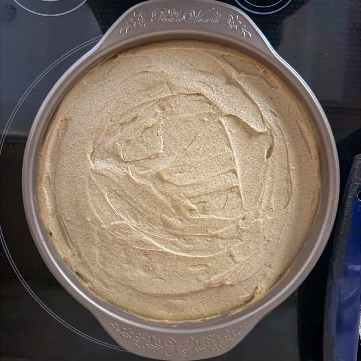 Vegan lime pie in the pie pan before going into the oven.