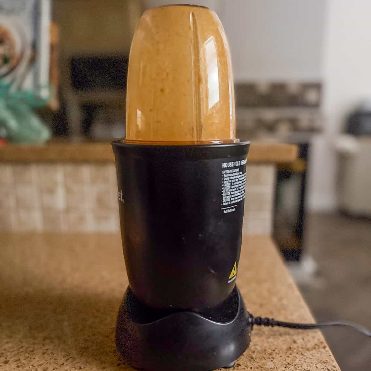 Sauce ingredients being blended in a bullet blender.
