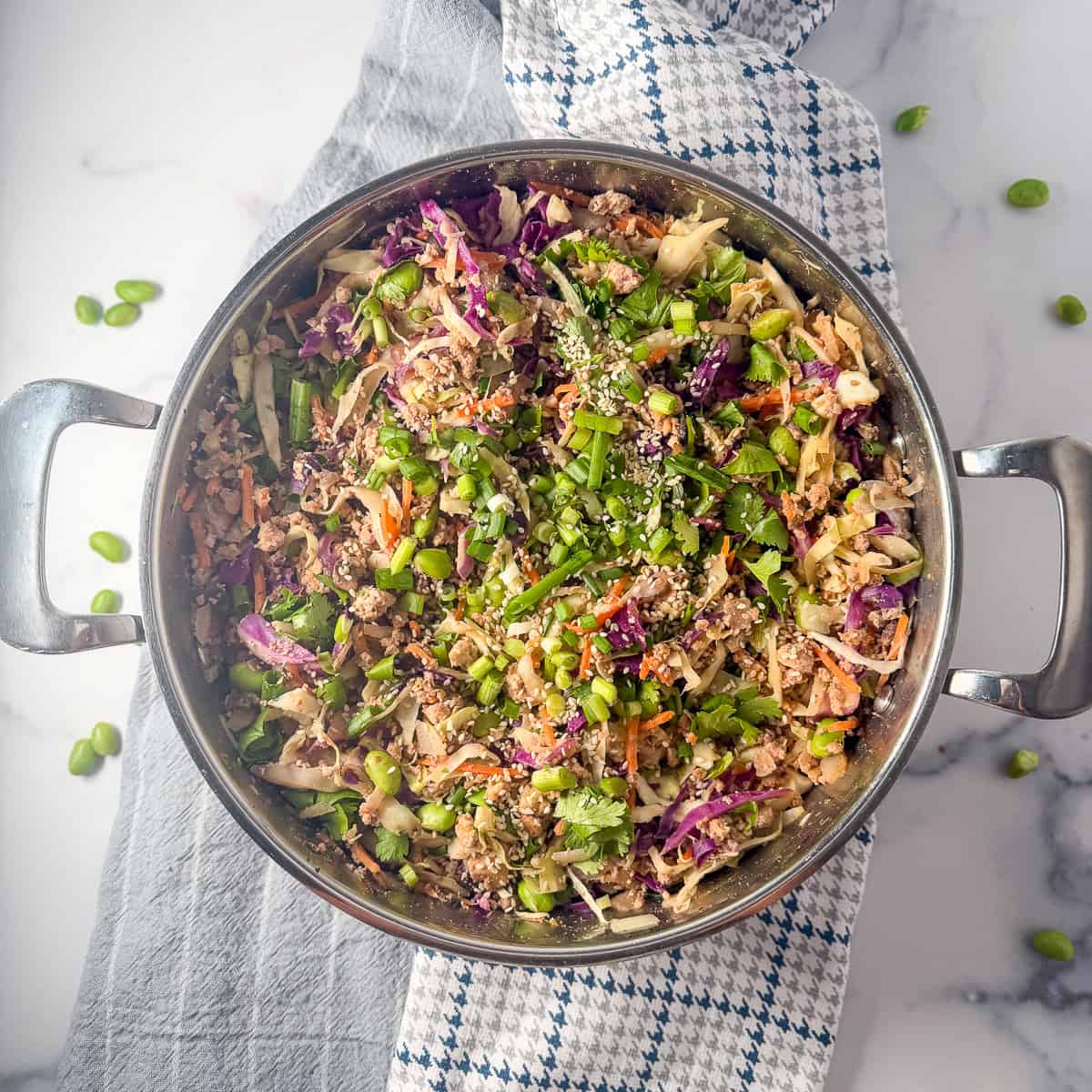 Vegan egg roll in a bowl in a large pot.